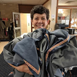 Di Agostino with a bundle of tablecloths